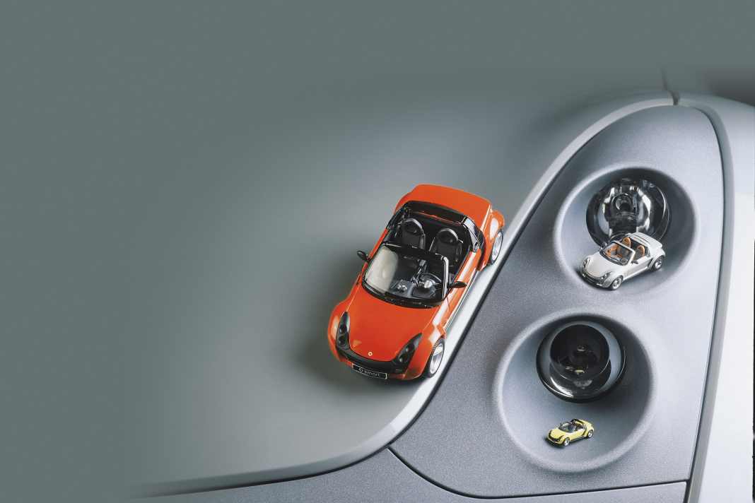 Das Foto zeigt die Smart von Kyosho (1:18), Minichamps (1:43) und Busch (1:87).