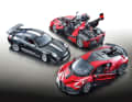 Der Porsche 911 GT3 RS (2011) strahlt in tiefem Schwarz, die 1:18- Modelle des Ferrari FXX K und Bugatti Divo in Rot-Tönen
