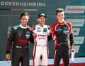 Clemens Schmid (Lamborghini) und die beiden Audi-Piloten René Rast und Marius Zug