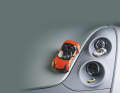Das Foto zeigt die Smart von Kyosho (1:18), Minichamps (1:43) und Busch (1:87).