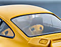 Der gelbe 911 (964) RS 3.8 von Solido aus Die Cast tritt gegen den roten RS 3.6 Clubsport von GT Spirit im Maßstab 1:18 aus Resine an