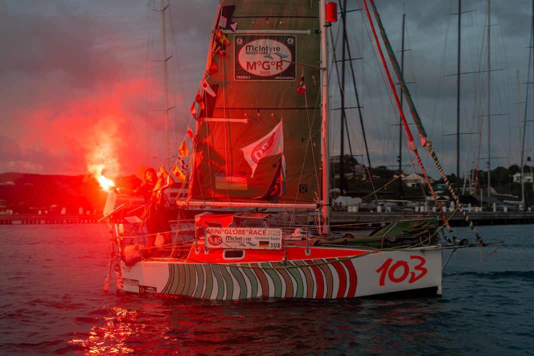 German participant Christian Sauer crosses the finish line after circumnavigating the globe