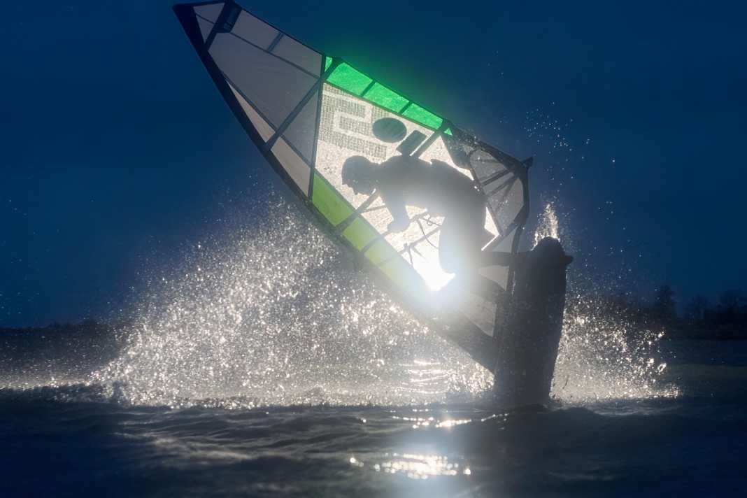 In the dark in ice water - windsurfing shoot at night