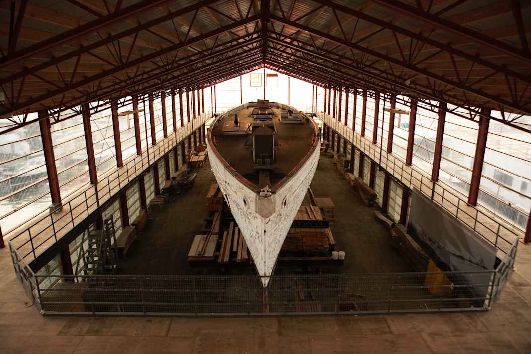 "Coronet" in its original condition in 2006, before work began on the hull. In its lightweight hangar on Narragansett Bay off Newport, the schooner looks like a beached whale