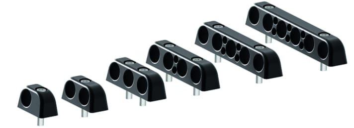 Les déviateurs Bolt-Down de Nodus sont disponibles au choix en plastique ou en aluminium. Les petits trous sont destinés à guider les lignes de déclenchement des stop-pièges Constrictor.