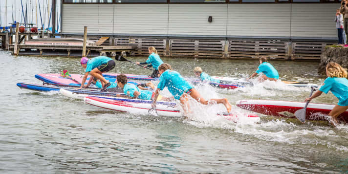 Just like the adults, the kids also start the race with a beach start.