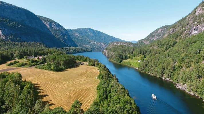 The cliffs drop steeply down to Lake Kviteseidvatnet, which is over 200 metres deep