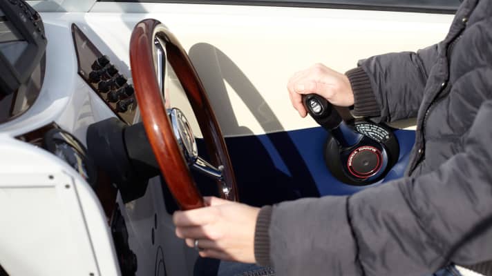 Left hand on the wheel, right hand on the throttle.