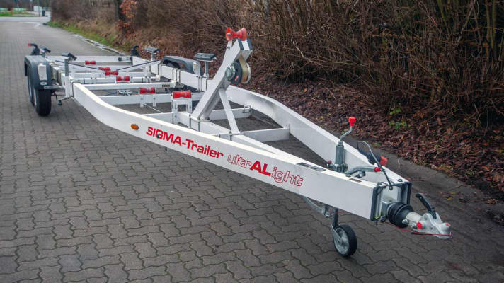 A classic motorboat trailer made of aluminium.