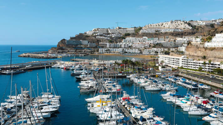 Puerto Rico with marina and beach, both protected by piers