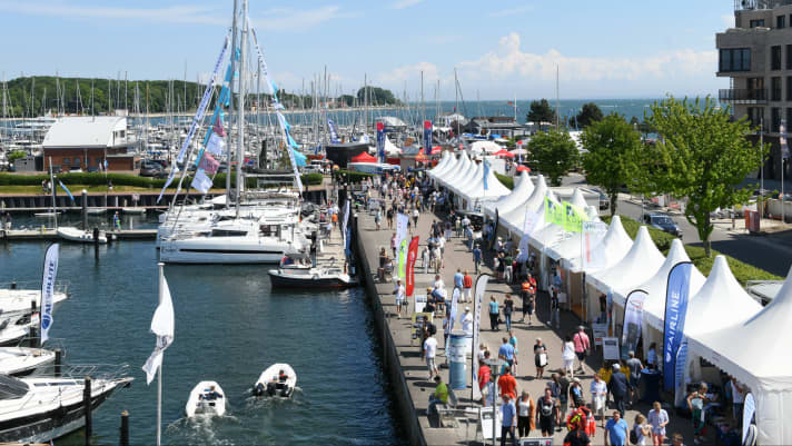 Pavilions with exhibitors along the promenade