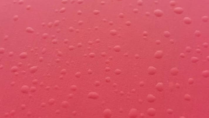 Hopefully you'll never see your board like this: Close-up of the surface of a hardboard that has been stored warm and damp in a bag.