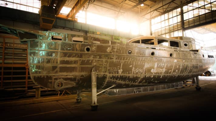   Full lines and a deckhouse characterise the boat