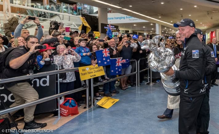   This is what Kiwi happiness looked like on their return home: Team boss Grant Dalton steps in front of the fans with the America's Cup