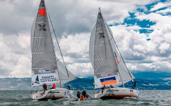 Classic match race scene on Lake Constance: two boats in a duel, the referees up close and personal