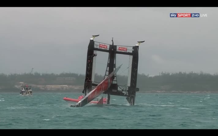   Like "Batman", Peter Burling shimmies over to his position at the top left of the picture - about ten metres above the water