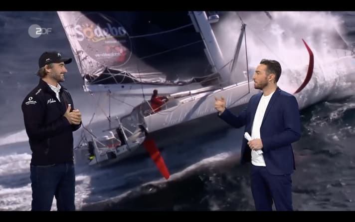   Boris Herrmann in a ZDF sports studio interview with presenter Sven Voss