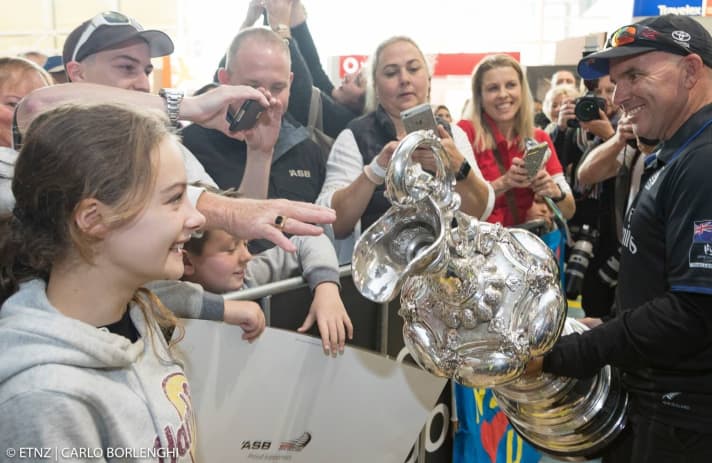   One touch, please! Tony Rae with the silver jug and the fans