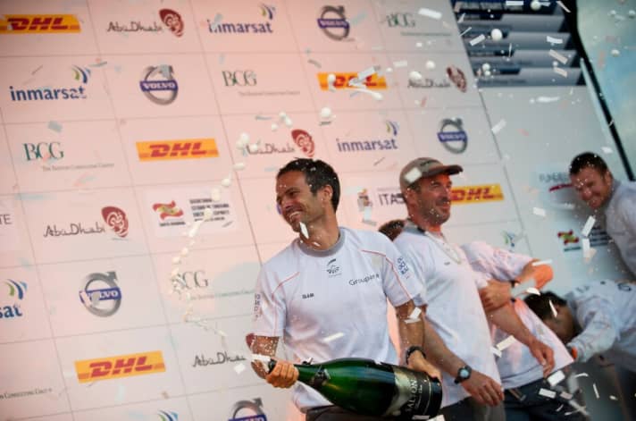   Franck Cammas celebrates victory with his crew