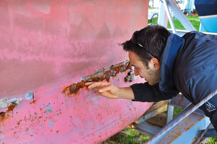   Cast iron keels are rarely completely free of rust. It is more important to check the transition from the hull to the keel for cracks