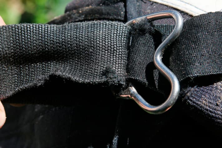 Abraded straps on the harness