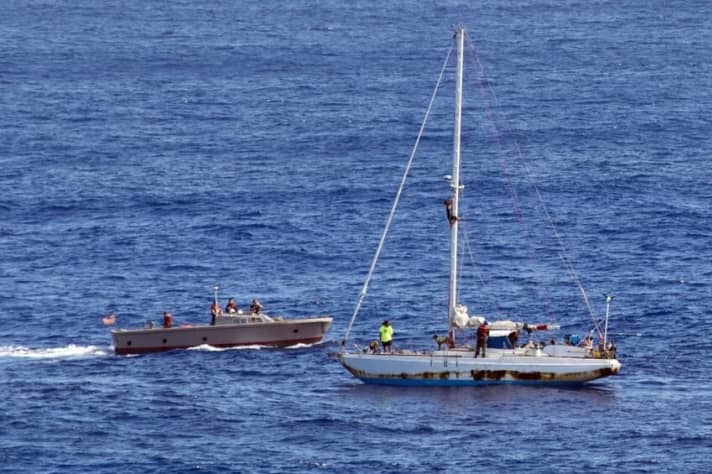   A tender of the "USS Ashland" approaches the "Sea Nymph" in October to rescue the American women