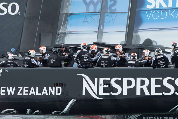   Tom Cruise (black helmet, dark glasses) cranking