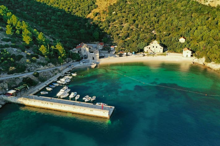 There are crystal-clear waters and a beach bar on the pier here: Bresčine