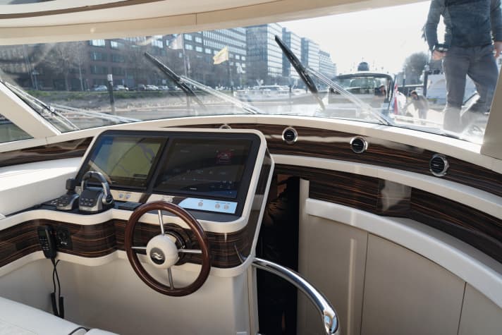 The bed in the owner’s suite offers a stunning view from the hull window
