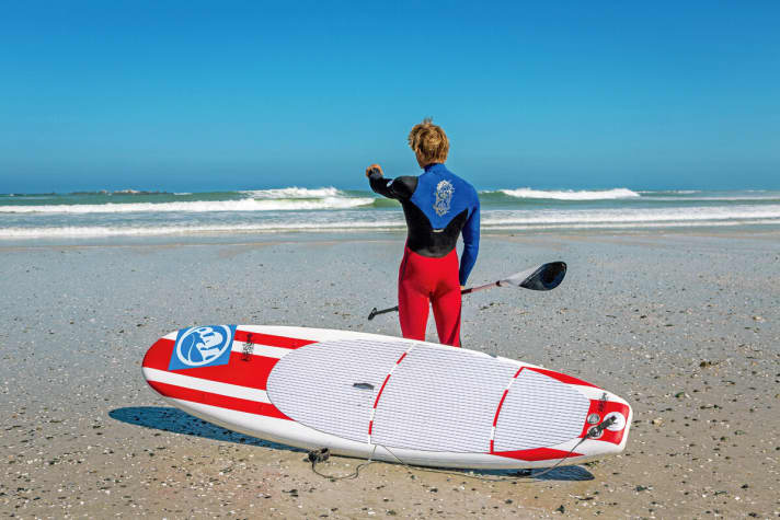Florian Jung watches the surf before paddling out.