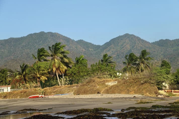 Windsurfing with a beautiful view of the Sierra Nevada. The mountain range where Colombia's highest peaks are located at 5775 metres.