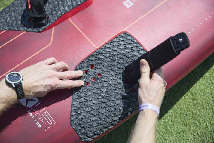 If you're not going full throttle over the water with camber sails, choose a board that also offers inwardly offset plugs.