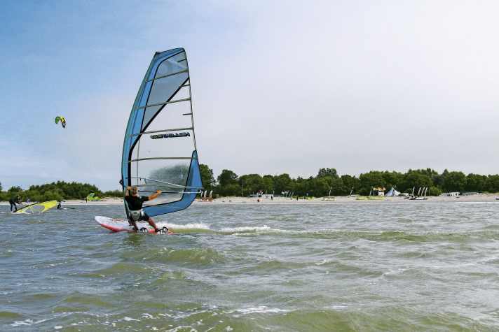 A leisurely freeride across smooth, hip-deep water.