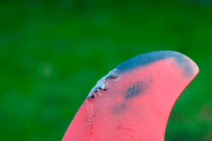   If necessary, apply further layers of adhesive and powder until the hole is completely filled.