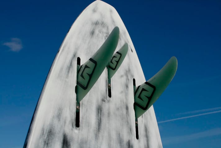   Inverted fin world: Patrik Diethelm puts the large fins on the outside of the board and a small centre fin in the middle.