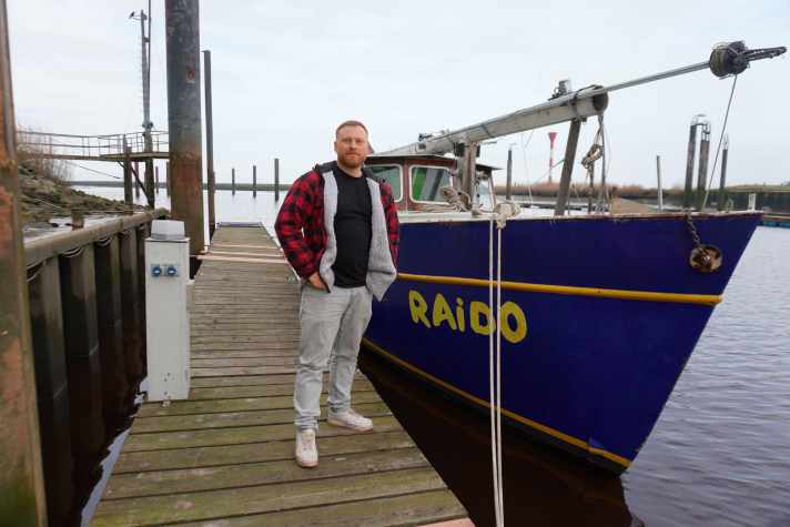 Nico Lohner next to his upmarket yacht "Raido"