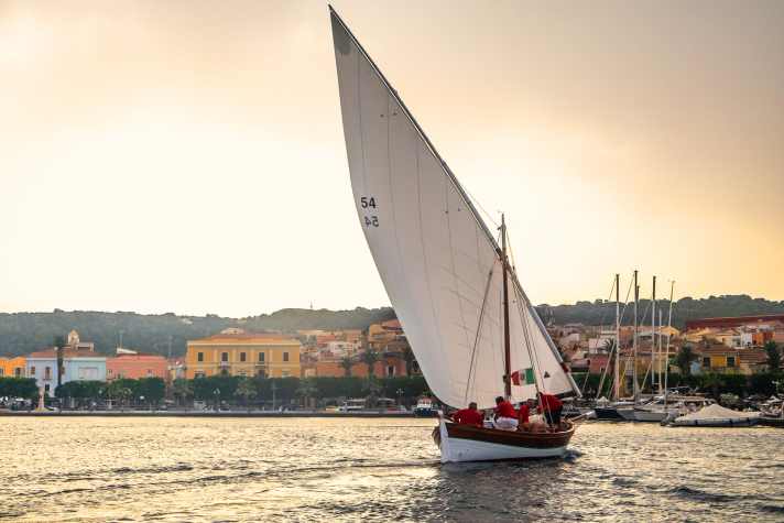 Isola di San Pietro, Carloforte, Sardinia, Italy. Boat type: Gozzo, old tuna boat with lateen sail. Name "Luigi Padre". Owner: Adolfo and son Luigi Simonetti. Copyright: Marc Bielefeld 2024