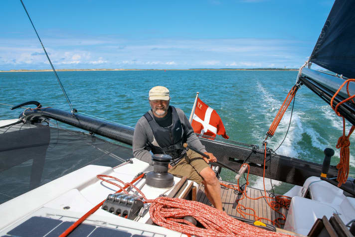 In single-handed sailing, the boat is steered with the tiller in the cockpit, which directs the blades on the floats