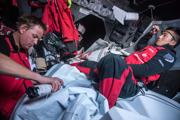   Repair of a tear in the sail of the Dongfeng Race Team