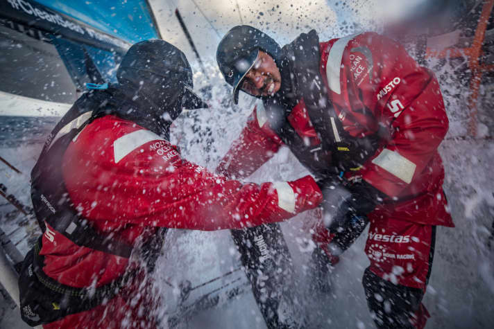   Tough workplace in the Vestas 11th Hour Racing team: Stacey Jackson and Tom Johnson on the grinder