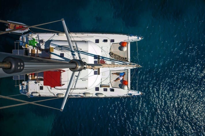   The cat almost fills a sports swimming pool. One lap around the boat is 70 metres