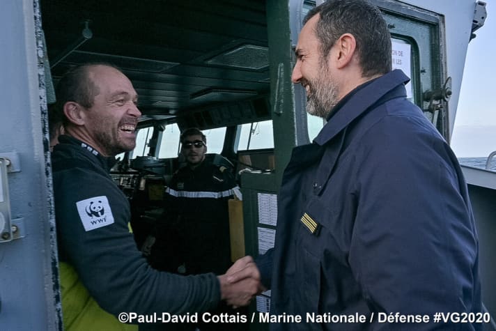   As he is greeted on board the "Nivôse", Kevin Escoffier can see both the exertions of the past week and his happiness at being rescued