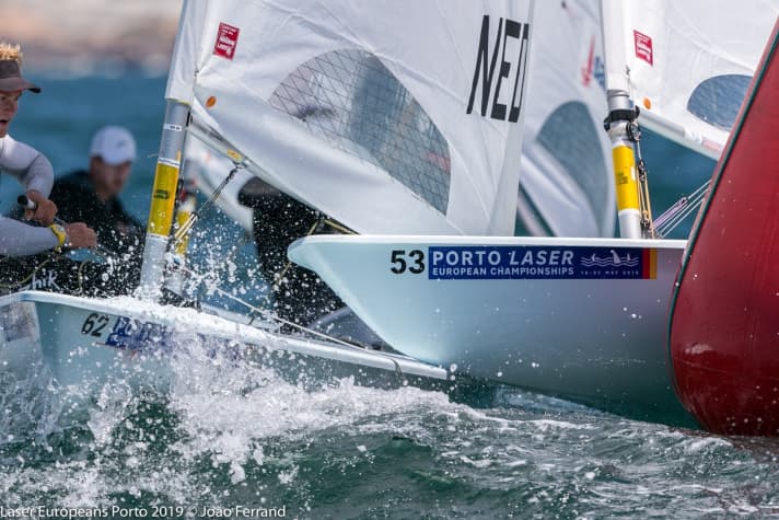   You have to take a closer look at the picture: On the left is the shocked expression on the face of Finland's Yuri Hummel, while on the right the Laser of top Italian sailor Giovanni Coccoluto is leaning too far towards his opponent. It's that close in the large European Championship fleet...