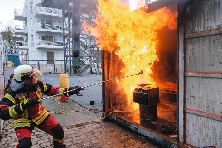   Do not imitate! We created a fat explosion under controlled conditions. Water is the wrong extinguishing agent for grease fires. It whips up the flames extremely quickly due to rapid evaporation