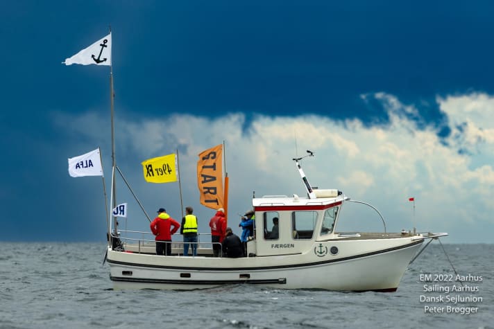   One of the Danish ships of the European Championship race organisation in front of a "foamed" sky backdrop