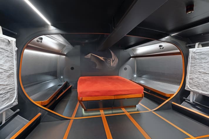 Technical compartment. The owner rests in the open foredeck. In addition to a lot of carbon, there is even some wood