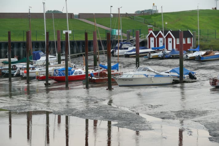 Yachts in the mudflats at low tide