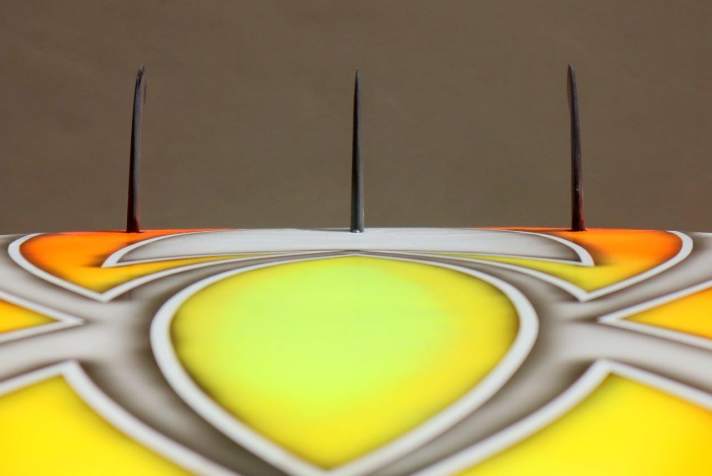 The outer fins are slightly angled and bent at the tip