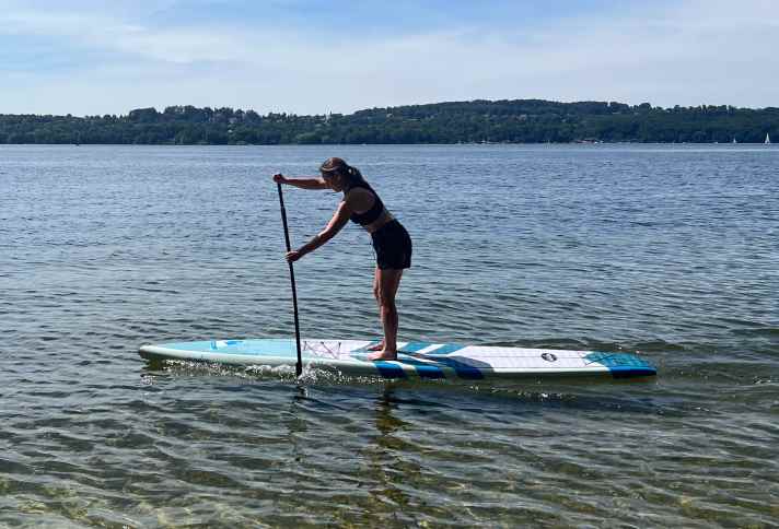 The standing position is close to the water for good stability.
