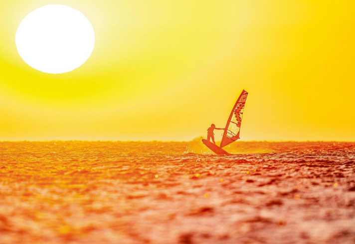 Linda Manková from the Meltemi station enjoys the morning hours on the board in Devils Bay before the start of her shift.